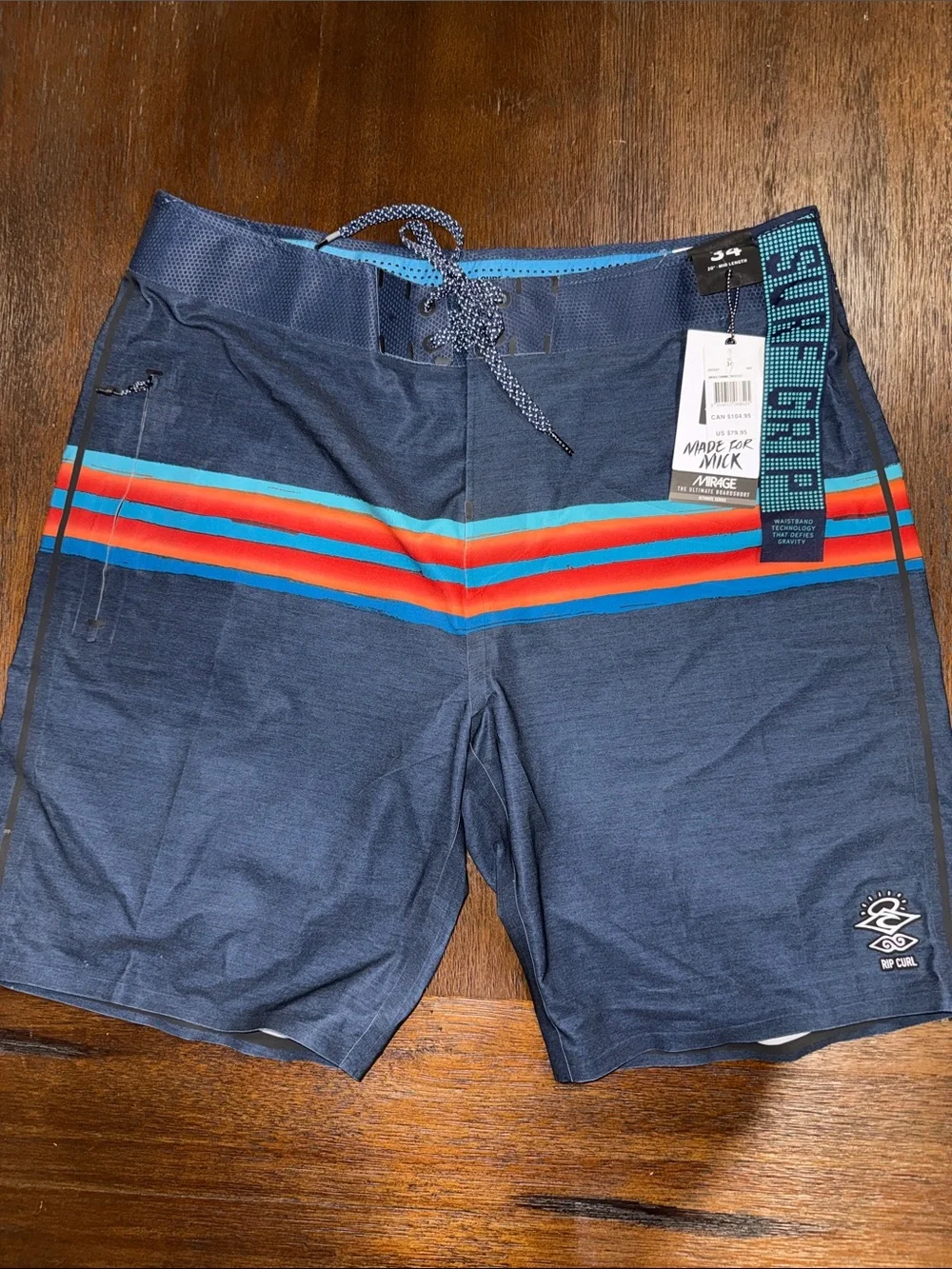 Rip Curl Mirage Mick Fanning Navy Board Shorts with Red & Aqua Stripes 34